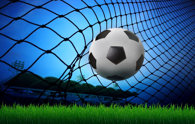 soccer ball in goal net 12